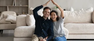 Use first image of Hispanic couple sitting on floor