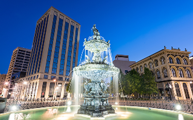 Montgomery, Alabama, USA fountain and downtown cityscape at twilight, cheap car insurance in Alabama.